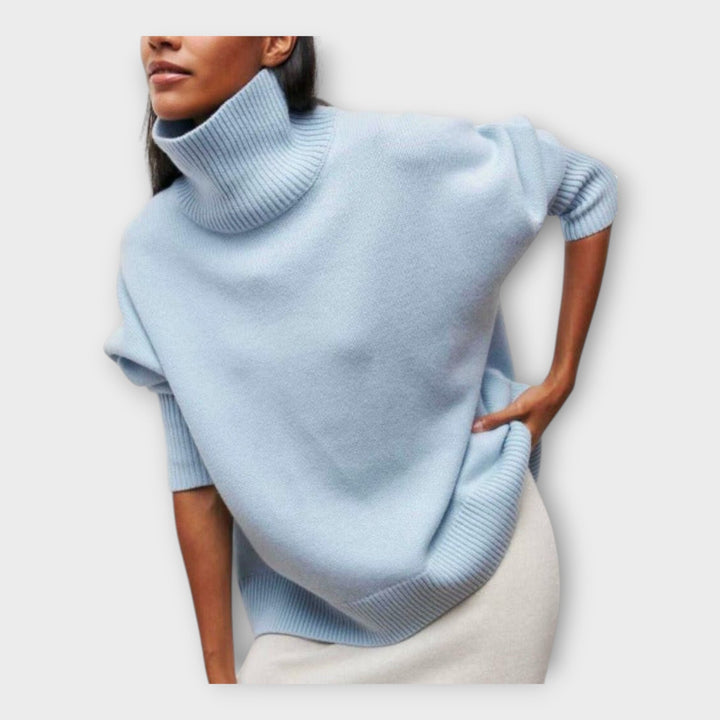 "Pleteni pulover z visokim ovratnikom" can be rewritten as "Pulover z visokim ovratnikom iz pletenine".